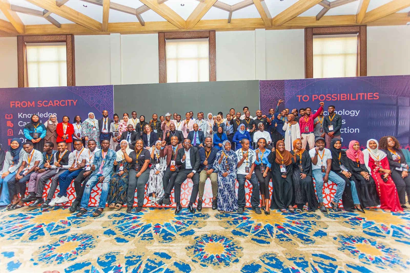 Attendees gather for a group photo in the main hall